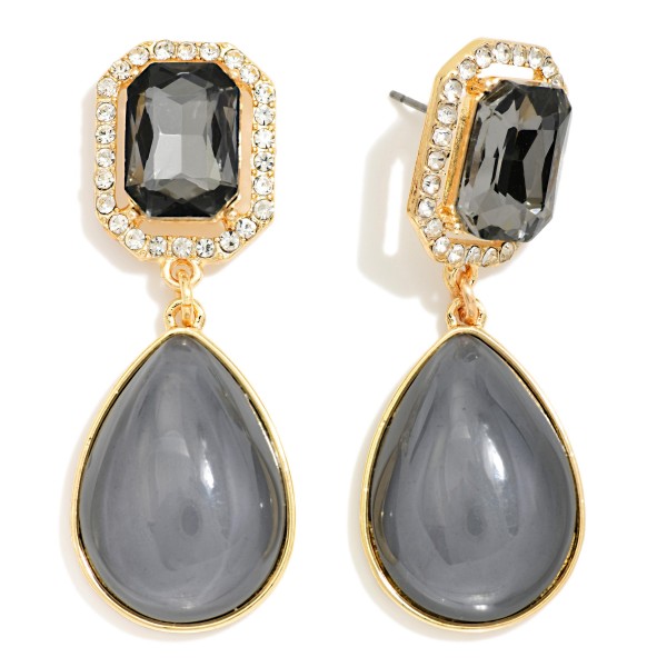 Crystal Halo Teardrop Statement Earrings with a rectangular step cut glass stone framed by a ring of sparkling rhinestones, suspending a glossy teardrop cabochon below. The mix of faceted sparkle and smooth polished drop gives an elegant, old Hollywood feel for weddings, holiday parties, and date nights. Post backs and a balanced weight keep them comfortable all evening. Glam drop earrings are a seasonal must have, and this design delivers a luxe look at a price that makes it an easy gift.