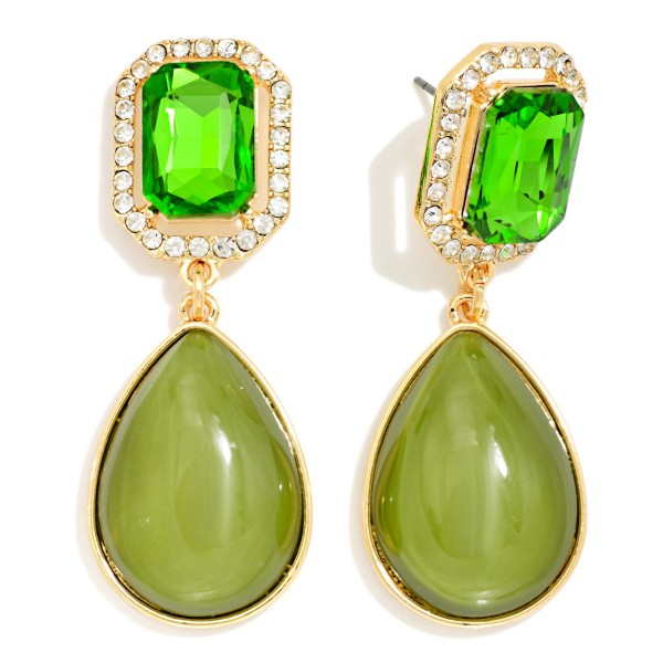 Crystal Halo Teardrop Statement Earrings with a rectangular step cut glass stone framed by a ring of sparkling rhinestones, suspending a glossy teardrop cabochon below. The mix of faceted sparkle and smooth polished drop gives an elegant, old Hollywood feel for weddings, holiday parties, and date nights. Post backs and a balanced weight keep them comfortable all evening. Glam drop earrings are a seasonal must have, and this design delivers a luxe look at a price that makes it an easy gift.