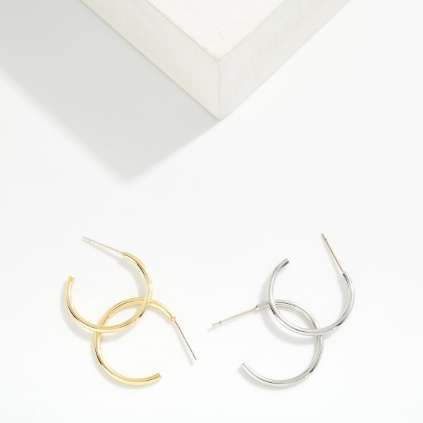 Thin Open Hoop Earrings in a sleek, lightweight metal with a simple post back closure. The slim C shape hoop sits close to the ear for an effortless everyday look that layers beautifully with studs and huggies. Comfortable enough to wear from morning to night and polished enough for the office. Classic hoops are a year round staple and a must stock basic that keeps boutique earring displays selling.