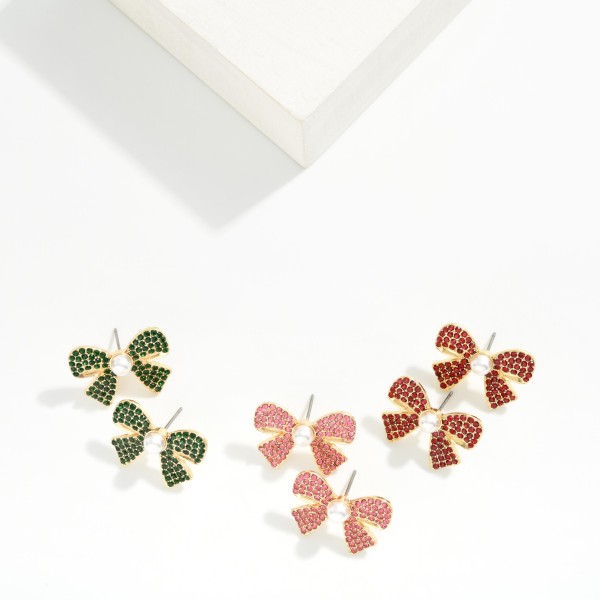 Rhinestone Bow Stud Earrings with a pearl center, featuring pave set crystals across a classic bow silhouette on comfortable post backs. The bow trend is still going strong, and these sparkle enough for holiday parties while staying easy to wear every day. A sweet pick for teacher gifts, friend gifts, and stocking stuffers. Displayed by the register, they make a quick add on that moves fast all season.