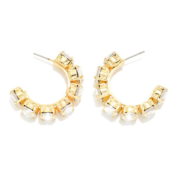 Rhinestone Station Hoop Earrings with faceted glass stones set in polished bezels around an open C hoop. The stones wrap the front of the hoop so sparkle shows from every angle, adding instant polish to casual looks and holiday party outfits alike. Lightweight post backs keep them comfortable all day. Jeweled hoops are a gift giving favorite, and this versatile style sells well across every age group.