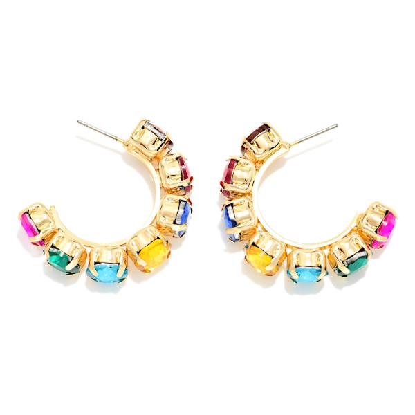 Rhinestone Station Hoop Earrings with faceted glass stones set in polished bezels around an open C hoop. The stones wrap the front of the hoop so sparkle shows from every angle, adding instant polish to casual looks and holiday party outfits alike. Lightweight post backs keep them comfortable all day. Jeweled hoops are a gift giving favorite, and this versatile style sells well across every age group.
