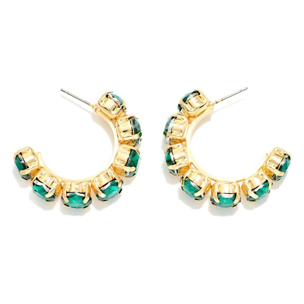 Rhinestone Station Hoop Earrings with faceted glass stones set in polished bezels around an open C hoop. The stones wrap the front of the hoop so sparkle shows from every angle, adding instant polish to casual looks and holiday party outfits alike. Lightweight post backs keep them comfortable all day. Jeweled hoops are a gift giving favorite, and this versatile style sells well across every age group.