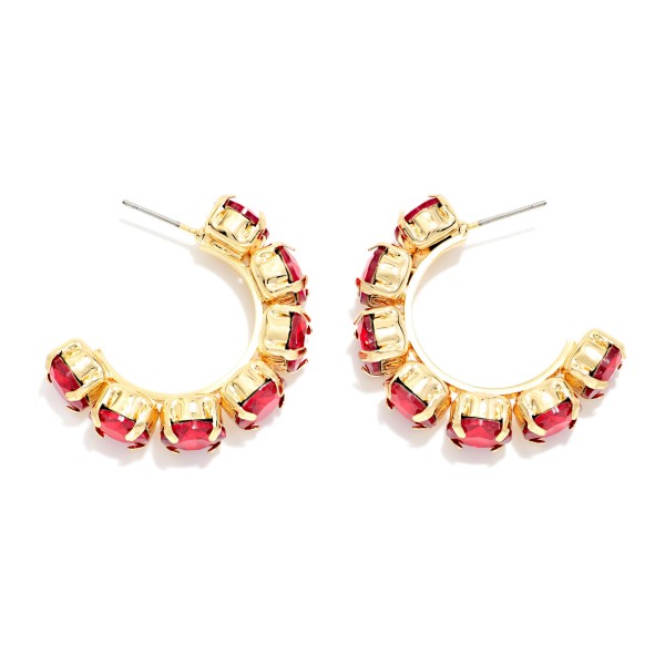 Rhinestone Station Hoop Earrings with faceted glass stones set in polished bezels around an open C hoop. The stones wrap the front of the hoop so sparkle shows from every angle, adding instant polish to casual looks and holiday party outfits alike. Lightweight post backs keep them comfortable all day. Jeweled hoops are a gift giving favorite, and this versatile style sells well across every age group.