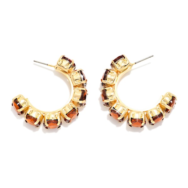 Rhinestone Station Hoop Earrings with faceted glass stones set in polished bezels around an open C hoop. The stones wrap the front of the hoop so sparkle shows from every angle, adding instant polish to casual looks and holiday party outfits alike. Lightweight post backs keep them comfortable all day. Jeweled hoops are a gift giving favorite, and this versatile style sells well across every age group.