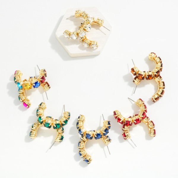 Rhinestone Station Hoop Earrings with faceted glass stones set in polished bezels around an open C hoop. The stones wrap the front of the hoop so sparkle shows from every angle, adding instant polish to casual looks and holiday party outfits alike. Lightweight post backs keep them comfortable all day. Jeweled hoops are a gift giving favorite, and this versatile style sells well across every age group.