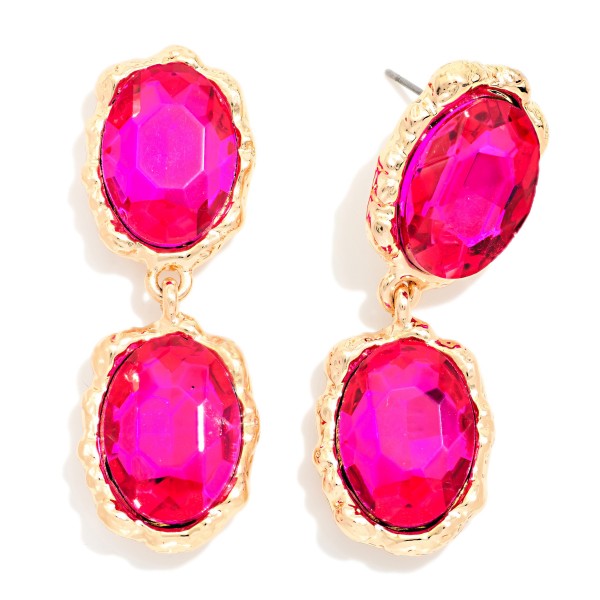 Oval Crystal Double Drop Earrings with two faceted glass stones stacked in organic, hammered style bezels. The textured settings give a vintage, heirloom feel while the oval stones deliver bold sparkle that frames the face. Lightweight post backs make them easy to wear from cocktail hour to the dance floor. Statement crystal earrings are a holiday season essential, and this design offers a high end look at an approachable boutique price.