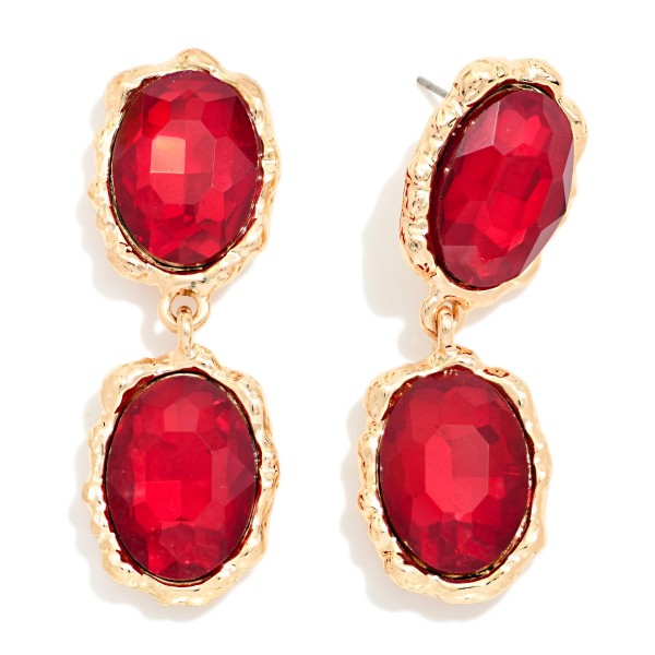 Oval Crystal Double Drop Earrings with two faceted glass stones stacked in organic, hammered style bezels. The textured settings give a vintage, heirloom feel while the oval stones deliver bold sparkle that frames the face. Lightweight post backs make them easy to wear from cocktail hour to the dance floor. Statement crystal earrings are a holiday season essential, and this design offers a high end look at an approachable boutique price.