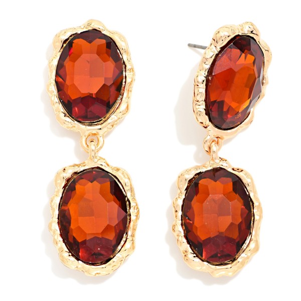 Oval Crystal Double Drop Earrings with two faceted glass stones stacked in organic, hammered style bezels. The textured settings give a vintage, heirloom feel while the oval stones deliver bold sparkle that frames the face. Lightweight post backs make them easy to wear from cocktail hour to the dance floor. Statement crystal earrings are a holiday season essential, and this design offers a high end look at an approachable boutique price.