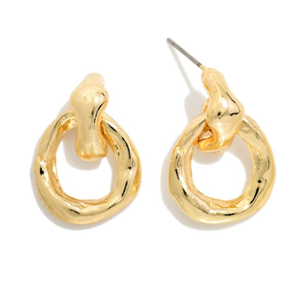 Twisted Knot Drop Earrings with a sculpted knot post and an open, polished loop below for a modern take on the classic door knocker style. The smooth, high shine finish makes them easy to wear with everything from casual knits to evening wear. Post backs keep them secure and comfortable. Sculptural metal earrings are a current best seller and a dependable everyday staple for any boutique.