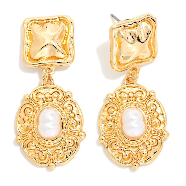 Baroque Pearl Drop Earrings with an ornate, vintage inspired frame surrounding a glossy faux pearl center under a textured square post. The antique look makes them a beautiful match for holiday dresses, weddings, and special occasions. Post backs keep them secure and comfortable. Romantic, heirloom style earrings like these appeal to classic shoppers and sell well as gifts.
