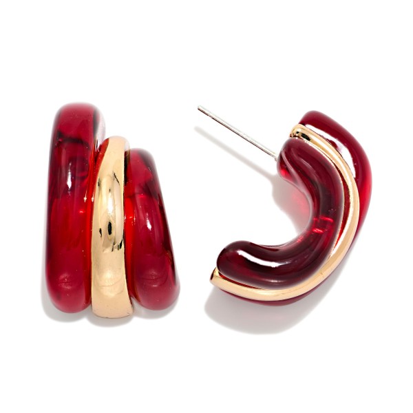 Layered Resin and Metal Hoop Earrings pairing a glossy acetate hoop with a polished metal band for a bold, dimensional look. The open C shape and post back keep them lightweight and easy to wear. A standout choice for fall outfits, holiday parties, and weekend style. Chunky resin hoops remain a strong trend and are an easy impulse buy at boutique price points.