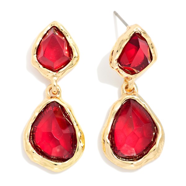 Double Glass Stone Drop Earrings pairing a smaller organic stone with a larger teardrop, each set in a polished bezel. The irregular faceting gives a soft, vintage glow that flatters every skin tone. Wear them to holiday parties, weddings, and dinners out. A gem inspired statement that adds sparkle to any outfit and sells quickly as a gift.