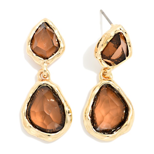 Double Glass Stone Drop Earrings pairing a smaller organic stone with a larger teardrop, each set in a polished bezel. The irregular faceting gives a soft, vintage glow that flatters every skin tone. Wear them to holiday parties, weddings, and dinners out. A gem inspired statement that adds sparkle to any outfit and sells quickly as a gift.