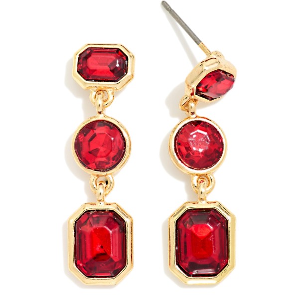Linear Crystal Drop Earrings featuring three graduated glass stones in octagon, round, and emerald cut shapes set in polished prongs. The elongated design adds instant sparkle to holiday party looks, weddings, and evening events. Post backs keep them secure and comfortable. A classic, dressy style that customers buy for themselves and as gifts, making it a reliable seller through the holiday season.