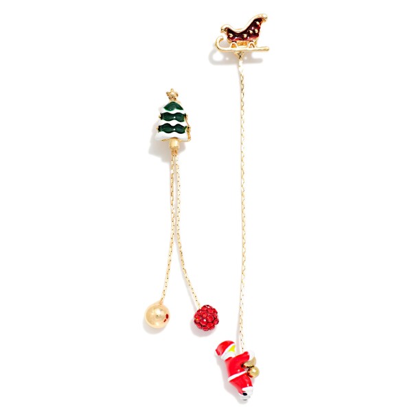 Mismatched Christmas Dangle Earrings featuring an enamel tree stud with chain drops of ornament charms and a tiny Santa, paired with a sleigh stud trailing a long delicate chain. The asymmetric design tells a little holiday story on each ear and moves with every turn. Fun for Christmas parties, holiday markets and festive date nights. A conversation starter style that stands out on any holiday jewelry display.
