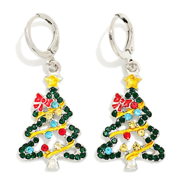 Rhinestone Christmas Tree Drop Earrings packed with sparkling stones, a tinsel style garland, a bow accent, and a star on top. Each tree dangles from a small hinged hoop that clicks closed for a secure, comfortable fit. Easy to wear to holiday parties, church services, school programs, and family gatherings. A crowd favorite holiday shape that shoppers recognize instantly, so it sells through quickly from November through New Year's.