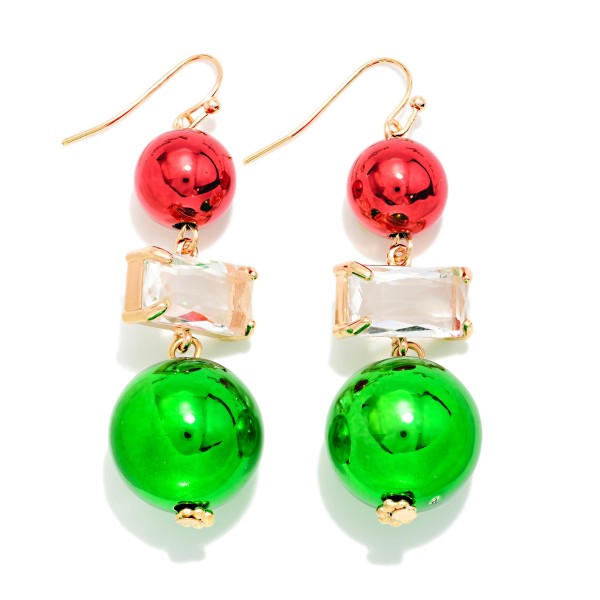 Christmas Ornament Drop Earrings with shiny metallic ball ornaments and a faceted rectangle crystal stacked on lightweight fishhook wires. The high shine finish catches the light like real tree ornaments, giving holiday outfits an instant festive pop without the weight. Made for ugly sweater parties, Christmas programs, office parties and family photos. A playful statement style shoppers grab on sight once the trees go up.