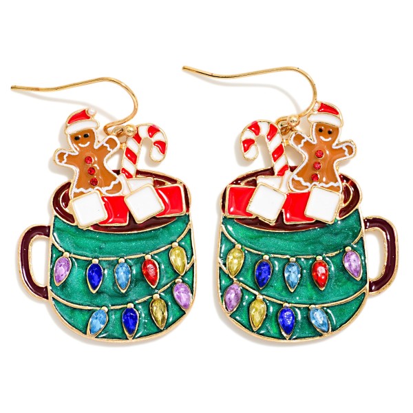 Hot Cocoa Mug Christmas Earrings with glossy enamel detail and sparkling rhinestone string lights wrapped around each mug. A tiny gingerbread man, marshmallows, and a candy cane peek over the rim, all hanging from lightweight fishhook wires. Perfect for holiday parties, cookie swaps, ugly sweater nights, and Christmas morning. A cozy, playful novelty style that shoppers grab as a stocking stuffer or gift, so it moves quickly all season long.