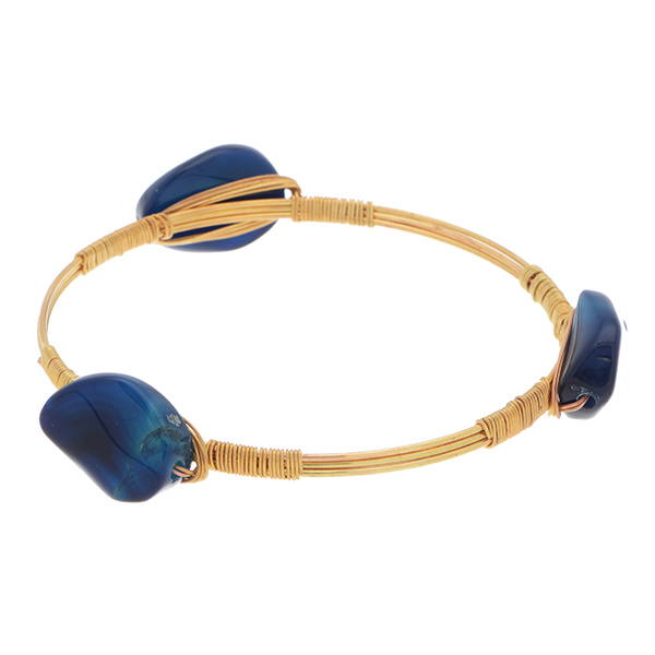 Gold tone wire bangle bracelet featuring blue tone agate stones.