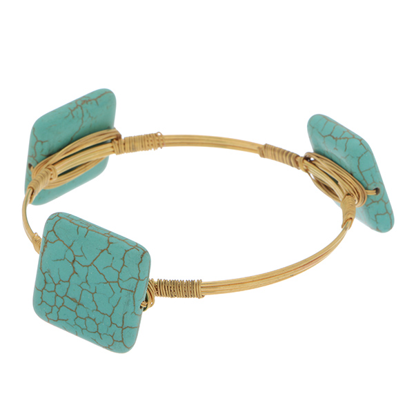 Gold tone wire bangle bracelet featuring square turquoise tone stones.