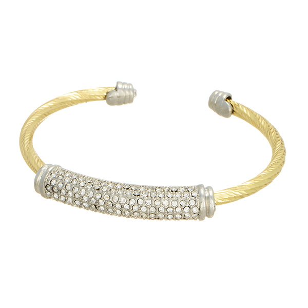 Gold and silver tone open ring bracelet with rhinestone accents.