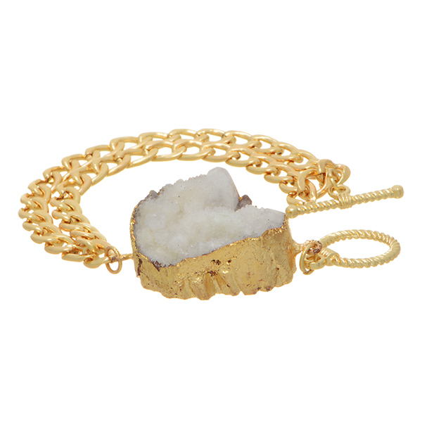 Gold tone toggle bracelet with double chains and a white geode druzy quartz focal. Approximately 7 1/2" in length. 