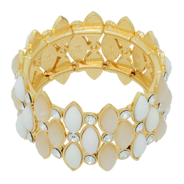 Gold tone stretch bracelet featuring white and ivory cabochons with rhinestone accents.
