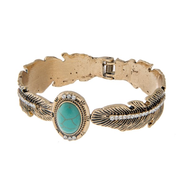 Wholesale burnished gold hinge cuff bracelet displaying feather rhinestones turq