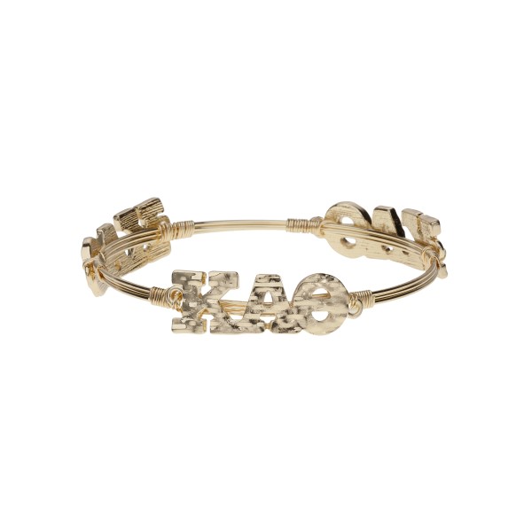 Gold tone Kappa Alpha Theta wire wrapped bangle bracelet.