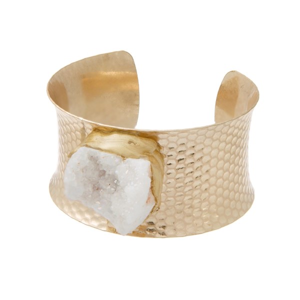 Gold tone cuff bracelet with a white druzy quartz stone focal.