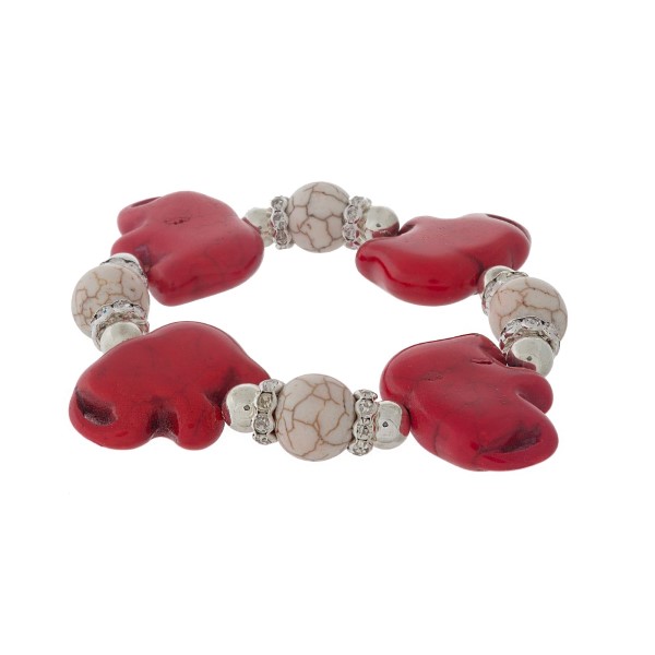 Silver tone stretch bracelet with ivory beads and red elephants. 