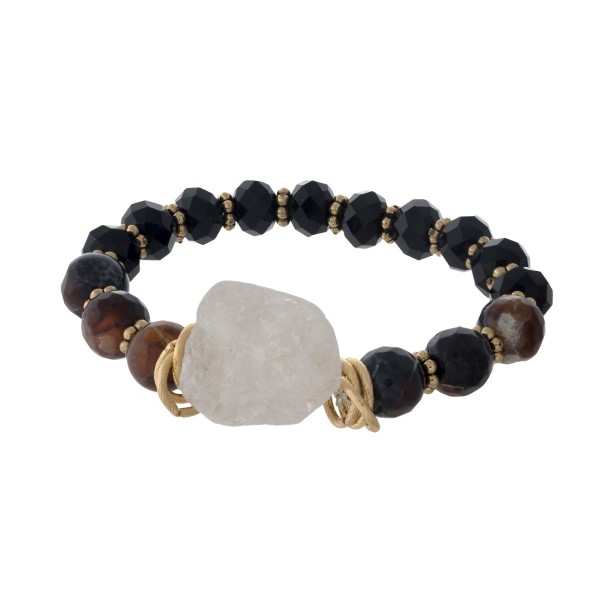 Black beaded stretch bracelet with a white natural crystal. 
