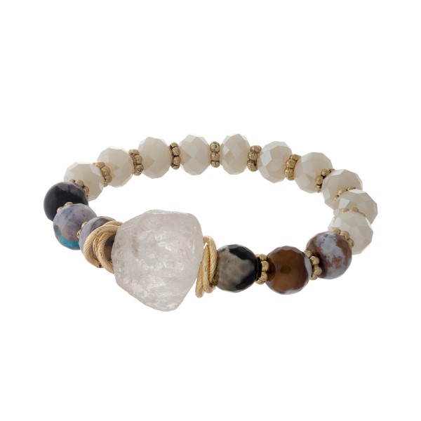 Ivory and gray beaded stretch bracelet with a white natural crystal. 