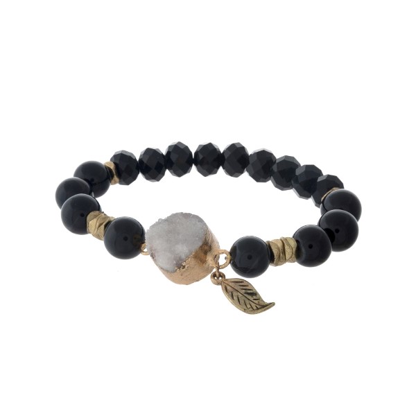 Black beaded stretch bracelet with a white druzy stone. 