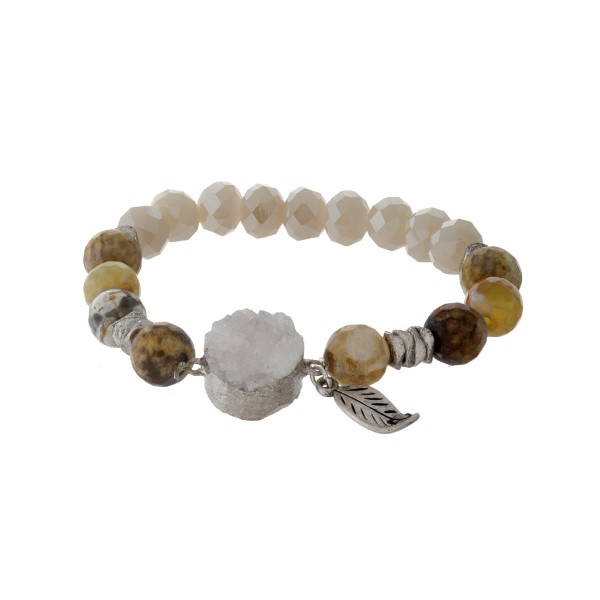 Brown and ivory beaded stretch bracelet with a white druzy stone. 