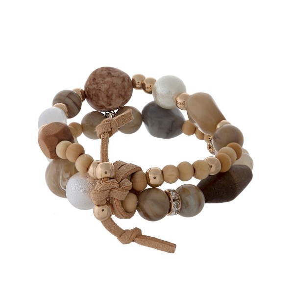 Gray, brown, and ivory beaded bracelet set. 