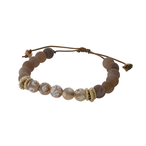 Brown cord adjustable bracelet with matte peach druzy and giraffe beads. Handmade in the USA.