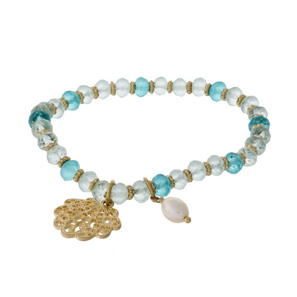 Turquoise and mint green beaded stretch bracelet featuring a gold tone seashell charm.