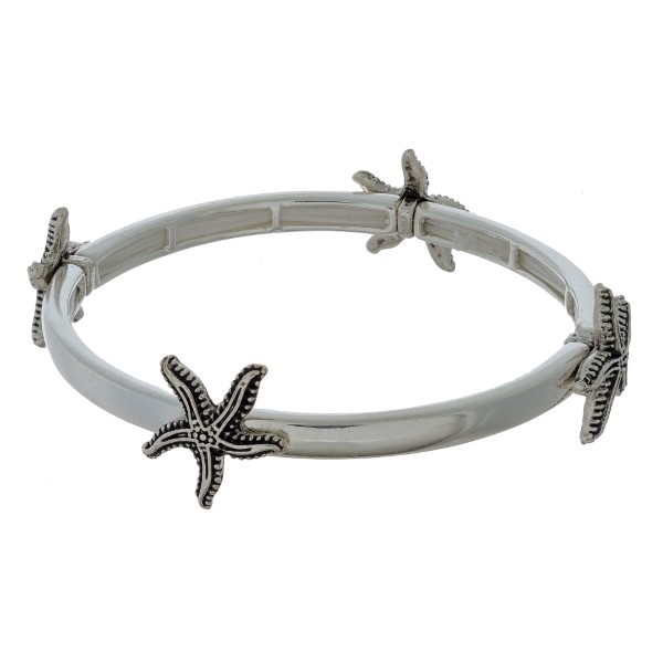Silver tone stretch bracelet with sea life stationaries. 