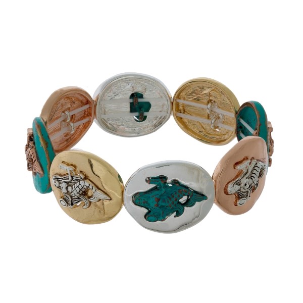 Tri-tone stretch bracelet with gold tone sea life focals. 