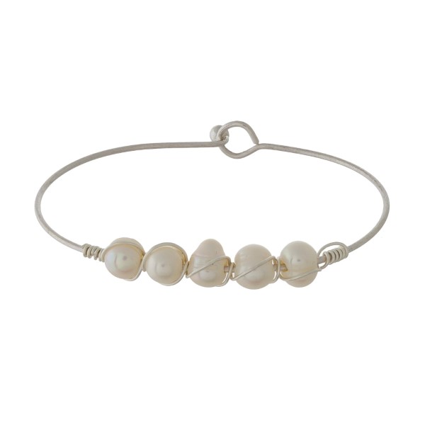 Ivory Pearl Wire Bangle Bracelet.

- Hook Closure
- Approximately 3" in Diameter