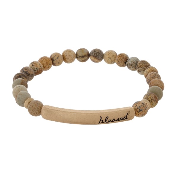 Beaded stretch bracelet with a bar focal, stamped with "blessed."