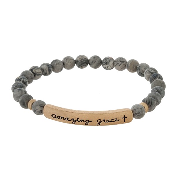 Beaded stretch bracelet with a bar focal, stamped with "amazing grace."