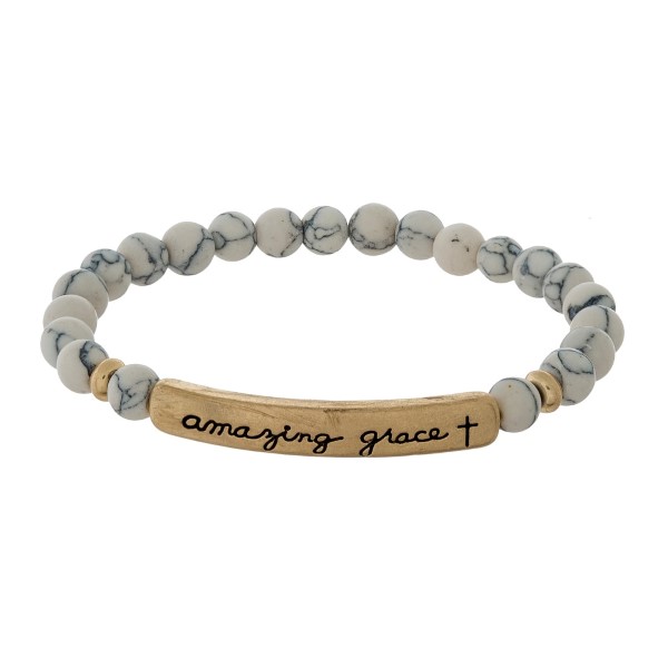 Beaded stretch bracelet with a bar focal, stamped with "amazing grace."