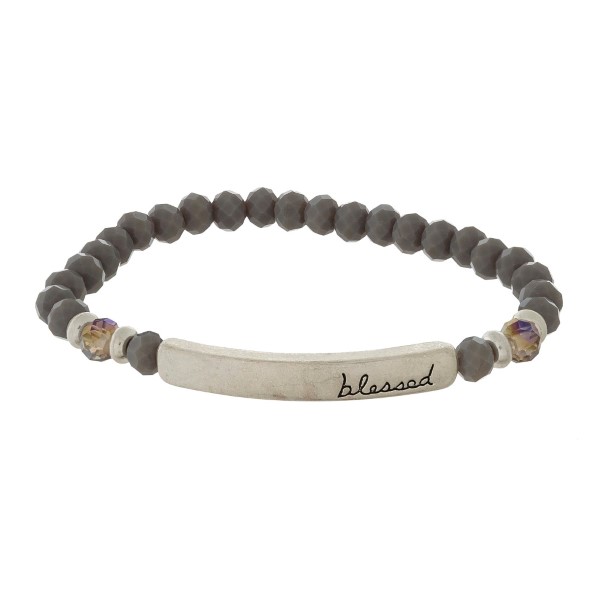 Beaded stretch bracelet with a bar focal, stamped with "blessed."