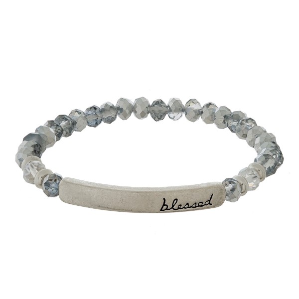 Beaded stretch bracelet with a bar focal, stamped with "blessed."