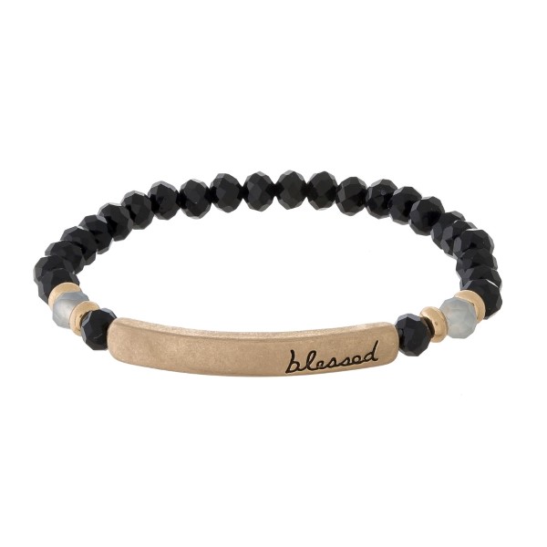 Beaded stretch bracelet with a bar focal, stamped with "blessed."