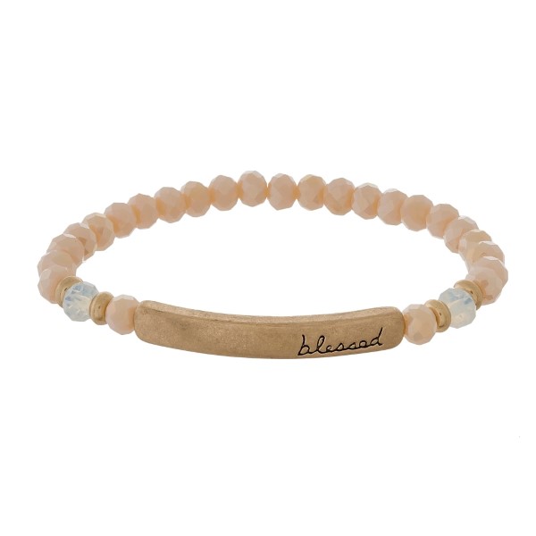 Beaded stretch bracelet with a bar focal, stamped with "blessed."