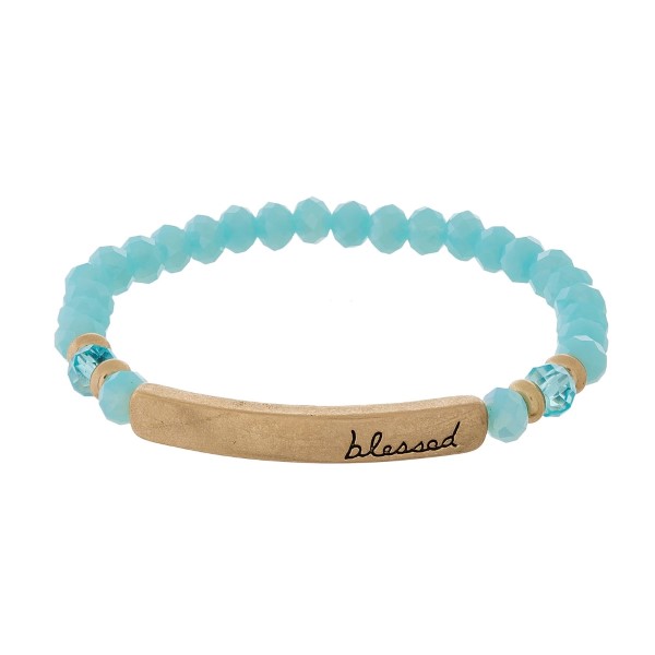 Beaded stretch bracelet with a bar focal, stamped with "blessed."